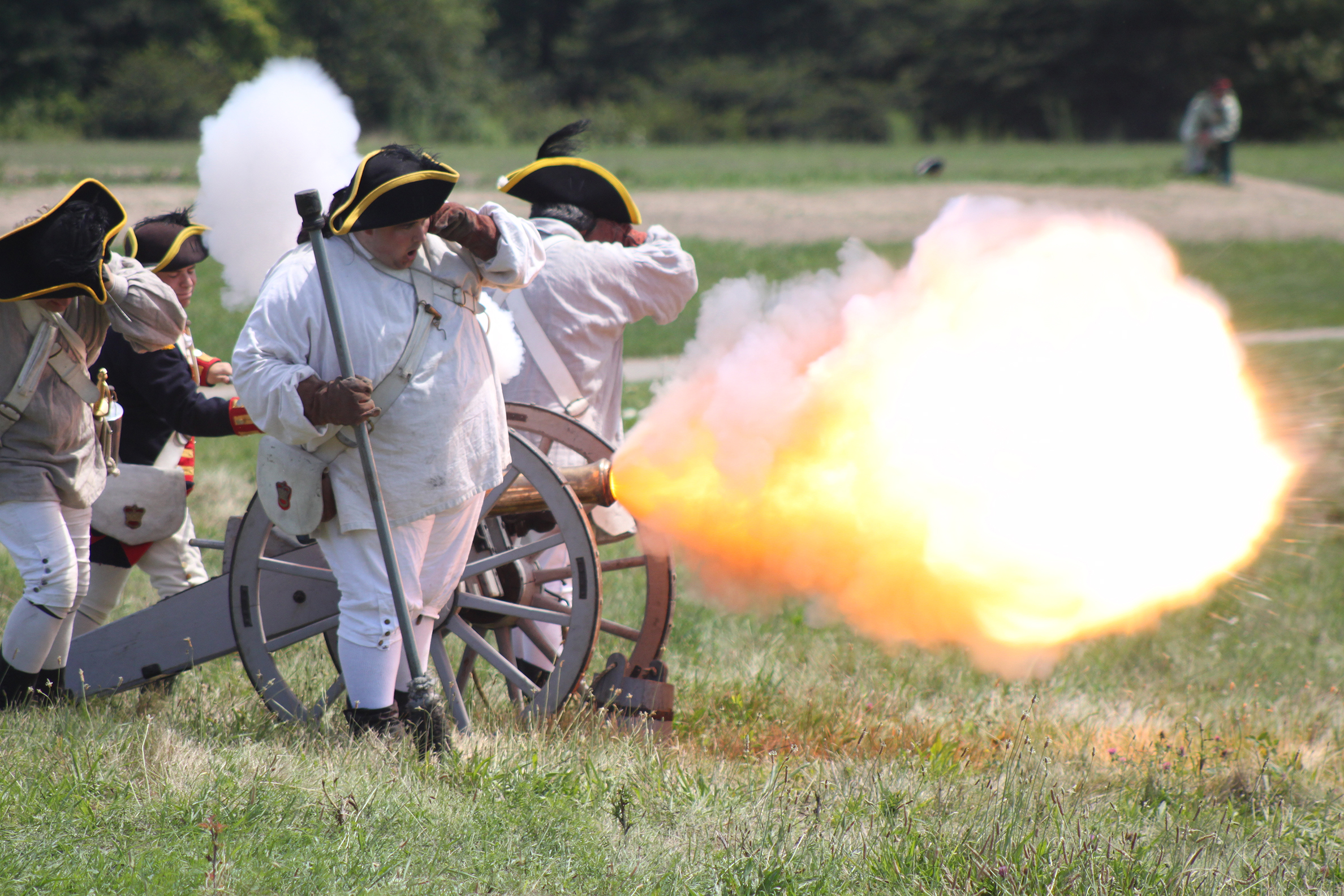 Reenactors demonstrate the firing of a British 3-pounder at Fort George, Niagara-on-the-Lake, Canada. 